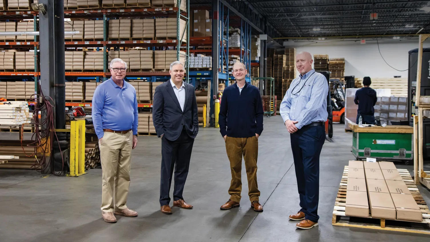 NESB bank lender and Barbour team standing next to each other in a warehouse