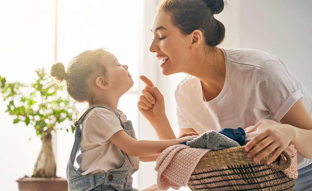 A mother playing with her small child