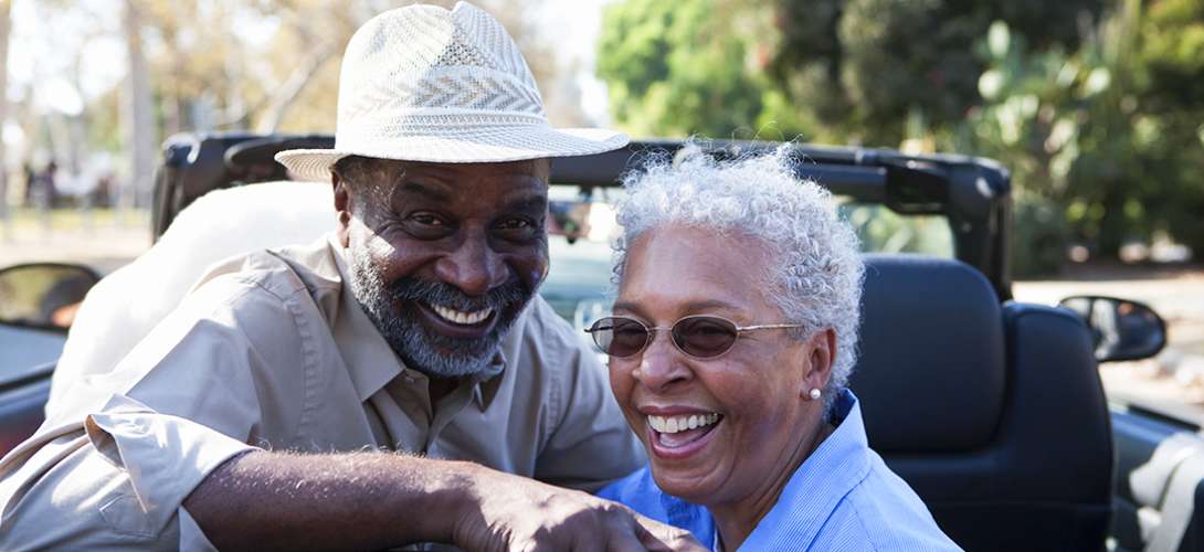 An older couple smile as they relax during their retirement.
