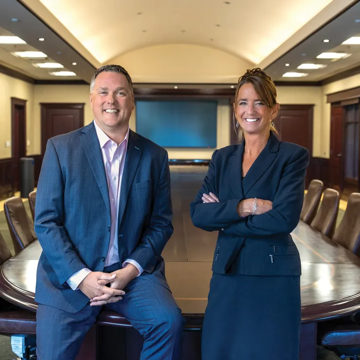 Rich Spencer and Aileen Zec professional portrait in a conference room